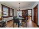 Bright dining room featuring a round table, hardwood floors, and charming accents at 3947 Winona Ct, Denver, CO 80212