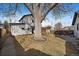 Large yard and patio with a grill and fire pit in this well maintained home at 3947 Winona Ct, Denver, CO 80212