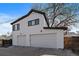 Exterior view of a two-story home with two garage doors at 3947 Winona Ct, Denver, CO 80212