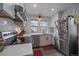 Modern kitchen with white cabinets, stainless steel appliances, and ample counter space at 3947 Winona Ct, Denver, CO 80212