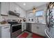 Renovated kitchen with stainless steel appliances, subway tile backsplash, and modern finishes at 3947 Winona Ct, Denver, CO 80212