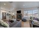 Bright living area with hardwood floors, fireplace, open to modern kitchen at 3947 Winona Ct, Denver, CO 80212