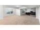 Spacious basement with large windows, beige carpet, and furniture in media room area at 9453 Lark Sparrow Dr, Highlands Ranch, CO 80126