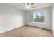 Bedroom featuring a ceiling fan and a large window at 9453 Lark Sparrow Dr, Highlands Ranch, CO 80126