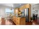 Spacious kitchen island, stainless steel refrigerator, and breakfast nook at 9453 Lark Sparrow Dr, Highlands Ranch, CO 80126