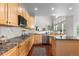 Modern kitchen featuring granite counters and stainless steel appliances at 9453 Lark Sparrow Dr, Highlands Ranch, CO 80126