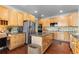 Updated kitchen with stainless steel appliances and granite countertops at 9453 Lark Sparrow Dr, Highlands Ranch, CO 80126