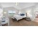 The primary bedroom has vaulted ceiling with a fan and plush carpet at 9453 Lark Sparrow Dr, Highlands Ranch, CO 80126