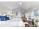 Bright main bedroom featuring a ceiling fan, vaulted ceiling and comfortable seating at 9453 Lark Sparrow Dr, Highlands Ranch, CO 80126