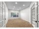 This office offers ample space with neutral carpeting, creating an ideal environment for focus and productivity at 9453 Lark Sparrow Dr, Highlands Ranch, CO 80126