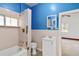 Bright bathroom featuring a shower over bath and a single sink vanity at 6025 S Sycamore St, Littleton, CO 80120