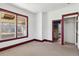 Bedroom with beige carpet and windows with maroon trim at 6025 S Sycamore St, Littleton, CO 80120