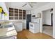 This kitchen features a sink, oven and microwave, white cabinets and vinyl flooring at 6025 S Sycamore St, Littleton, CO 80120