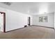 Spacious living room with light-colored carpet at 6025 S Sycamore St, Littleton, CO 80120