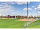 Bright baseball field adjacent to building, offering community recreation at 1881 E 95Th Ave, Thornton, CO 80229
