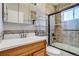 Tiled bathroom featuring a bathtub and vanity with sink at 1881 E 95Th Ave, Thornton, CO 80229