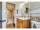 Tiled bathroom featuring a bathtub and vanity with sink at 1881 E 95Th Ave, Thornton, CO 80229