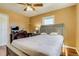 Comfortable bedroom with a ceiling fan and two windows letting in plenty of natural light at 1881 E 95Th Ave, Thornton, CO 80229