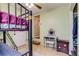 Bunkbeds in a room featuring tile floors and a rear door at 1881 E 95Th Ave, Thornton, CO 80229