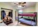 A shared bedroom with bunk beds and built-in closet storage at 1881 E 95Th Ave, Thornton, CO 80229