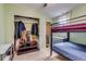 A shared bedroom with bunk beds and tile flooring at 1881 E 95Th Ave, Thornton, CO 80229