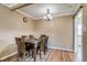Cozy dining area featuring a wood dining table and a chandelier at 1881 E 95Th Ave, Thornton, CO 80229