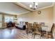 Neutral dining room with wood floors and plenty of space for entertaining friends and Gathering at 1881 E 95Th Ave, Thornton, CO 80229