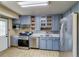 Modern kitchen featuring stainless steel appliances, light wood flooring, and ample cabinet space at 1881 E 95Th Ave, Thornton, CO 80229