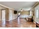 Bright living room showcasing wood floors, white leather sofa, and open floor plan at 1881 E 95Th Ave, Thornton, CO 80229