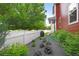 A backyard with a white fence, tasteful landscaping, a grill, and a view of the home at 2813 Central Park Blvd, Denver, CO 80238
