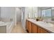 Modern bathroom with double vanities and a separate tub and shower, offering a spa-like experience at 2813 Central Park Blvd, Denver, CO 80238