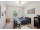 Charming bedroom with carpet, a cozy bed, and stylish decor at 2813 Central Park Blvd, Denver, CO 80238