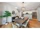 Stylish dining room with modern lighting and hardwood floors at 2813 Central Park Blvd, Denver, CO 80238