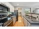 Contemporary kitchen with stainless steel appliances, gray countertops, and hardwood floors at 2813 Central Park Blvd, Denver, CO 80238