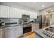 Modern kitchen with stainless steel appliances and gray countertops at 2813 Central Park Blvd, Denver, CO 80238