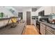 Well-appointed kitchen featuring updated appliances and a staircase at 2813 Central Park Blvd, Denver, CO 80238