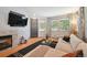 Cozy living room with hardwood floors, fireplace, and natural light at 2813 Central Park Blvd, Denver, CO 80238