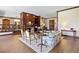Bright living room with elegant fireplace, wood trim and hardwood floors at 21 Huntwick Ln, Cherry Hills Village, CO 80113