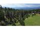 Aerial view of a home surrounded by nature at 23495 Bluestem Dr, Golden, CO 80401