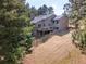 Exterior view of home and deck surrounded by a lush green lawn at 23495 Bluestem Dr, Golden, CO 80401