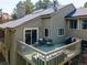 Outdoor deck with seating area and grill, perfect for entertaining guests at 23495 Bluestem Dr, Golden, CO 80401