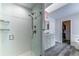 Modern bathroom with a glass-enclosed shower, sleek fixtures, and a well-organized vanity, providing a spa-like retreat at 23495 Bluestem Dr, Golden, CO 80401