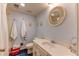 Classic bathroom with a shower, toilet, sink, and a decorative mirror at 23495 Bluestem Dr, Golden, CO 80401