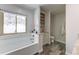 Charming bathroom featuring a bathtub, natural light, and functional storage, creating a relaxing and organized space at 23495 Bluestem Dr, Golden, CO 80401