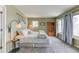 Serene bedroom with carpet, two windows, a full bed, and decoratively placed lighting fixtures, offering a cozy retreat at 23495 Bluestem Dr, Golden, CO 80401