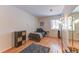 Neutral bedroom with a bed, black shelving, and a skateboard at 23495 Bluestem Dr, Golden, CO 80401
