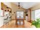 Charming dining area with an attractive ceiling fan and view of snowy outdoor scenery at 23495 Bluestem Dr, Golden, CO 80401