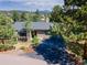 Charming home featuring mature trees, and a well-maintained driveway at 23495 Bluestem Dr, Golden, CO 80401