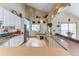 Modern kitchen featuring white cabinetry and a cozy breakfast nook with backyard access at 23495 Bluestem Dr, Golden, CO 80401