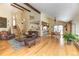 Open-concept living space with hardwood floors and access to the kitchen and dining area at 23495 Bluestem Dr, Golden, CO 80401